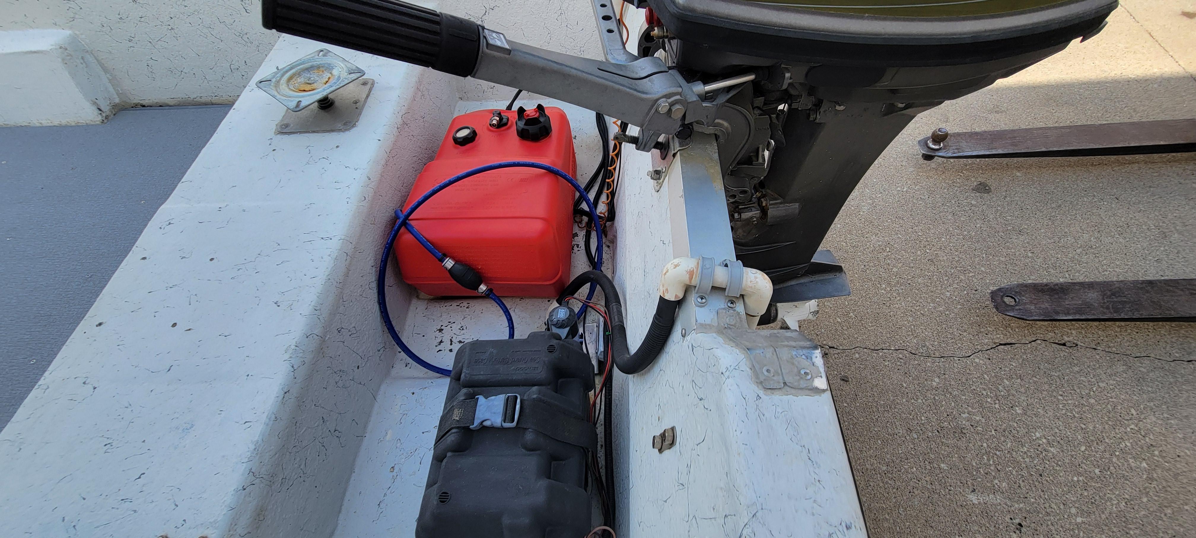 1996 Tracker Pro Angler V 16 boat with motor, fuel tank, and battery setup.
