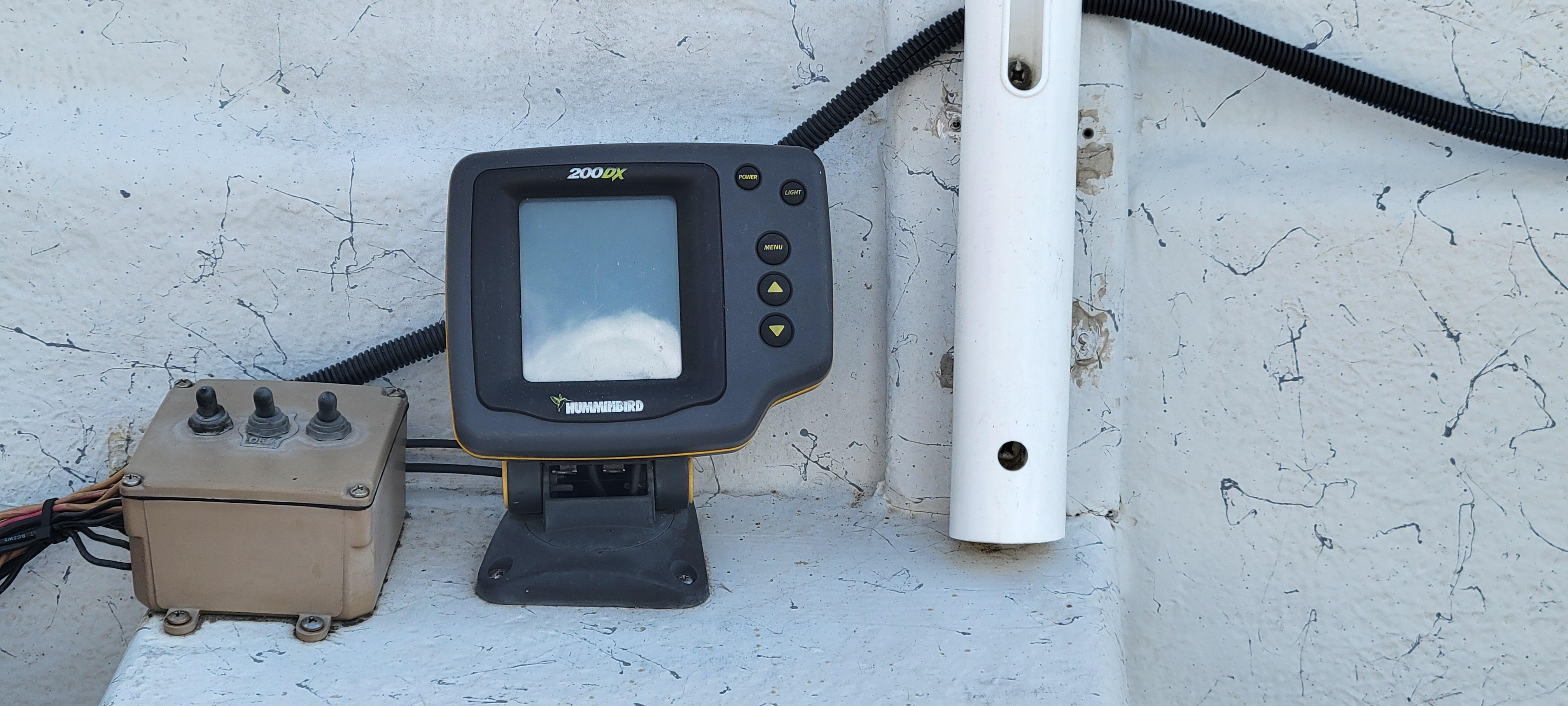 Fishfinder and control panel on a 1996 Tracker Pro Angler V 16 boat.