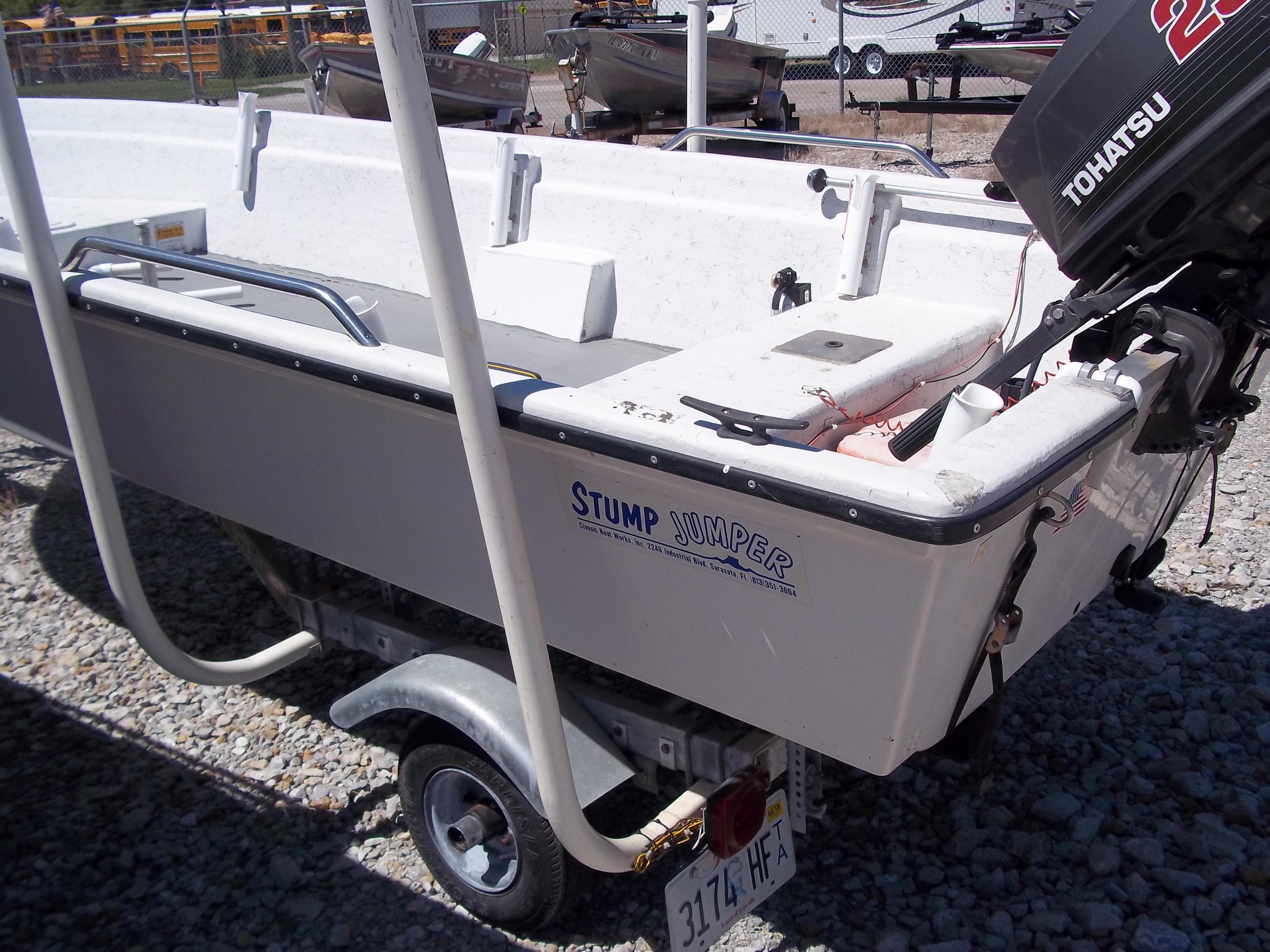 1996 Tracker Pro Angler V 16 boat with Tohatsu motor on a trailer.