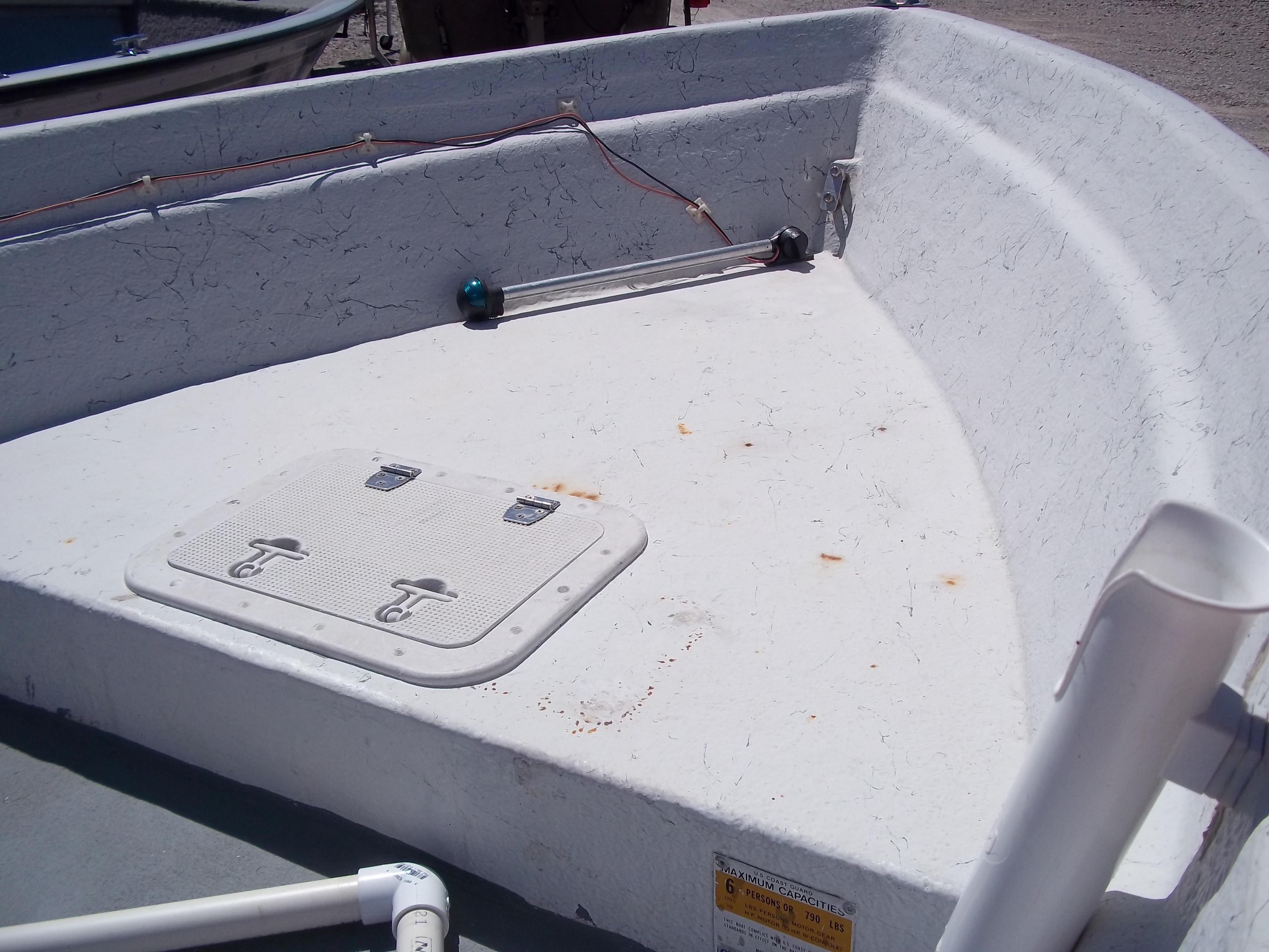 1996 Tracker Pro Angler V 16 boat interior with storage hatch and wiring.