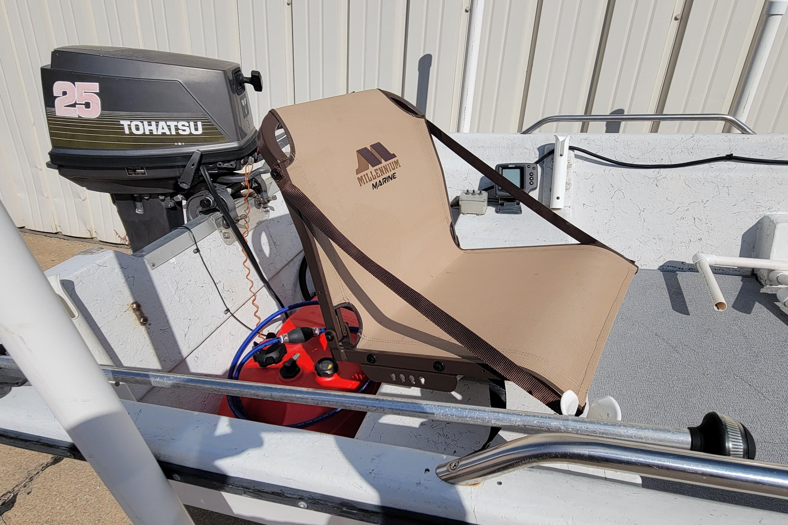 1996 DILKES STUMP JUMPER boat with Tohatsu 25 motor and Millennium Marine seat.
