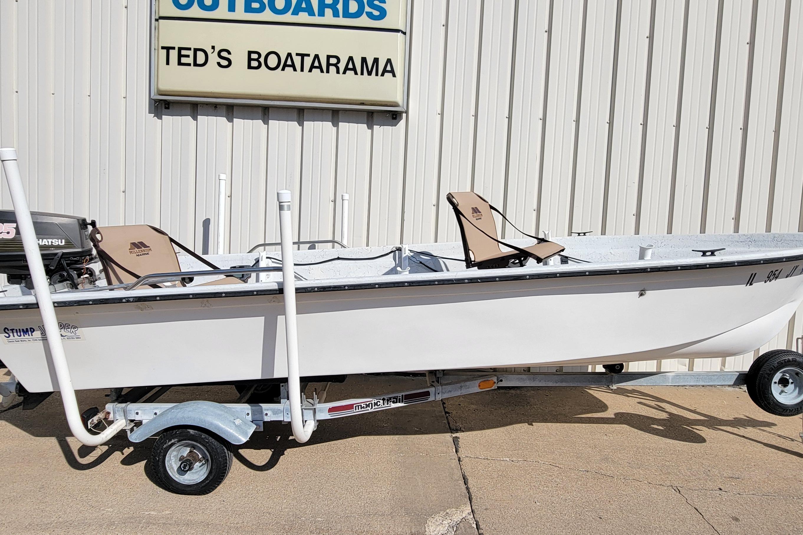 1996 DILKES STUMP JUMPER boat on trailer at Ted's Boatarama, featuring Tohatsu outboard motor.