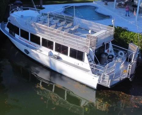 Custom-58 Tour Vessel 1990-CANYON ODYSSEY FL-US-Custom 1990 58 Tour Vessel docked near a poolside area.-8685116