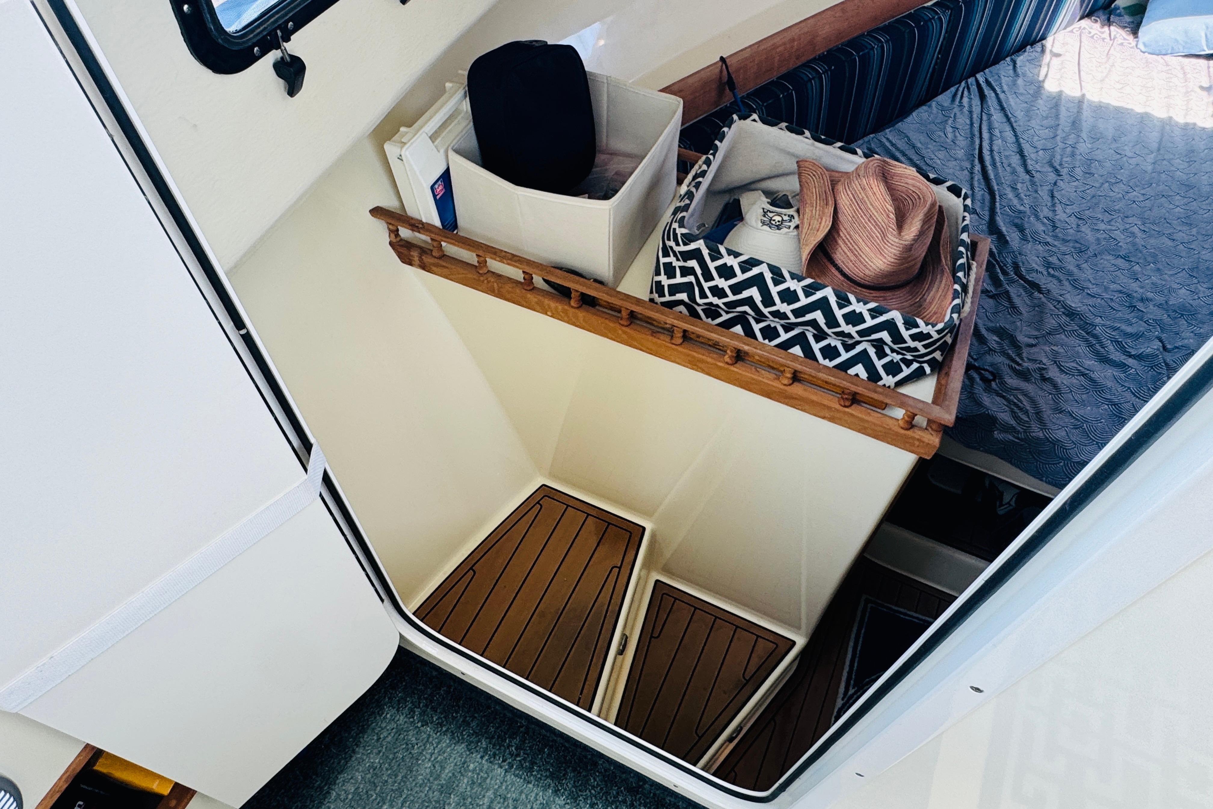 Interior of 2015 Eastern 270 Islander boat with storage and seating area.