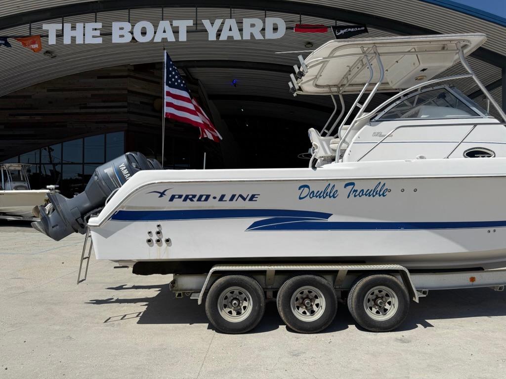 2000 Pro-Line 27 Walk boat on trailer at The Boat Yard.