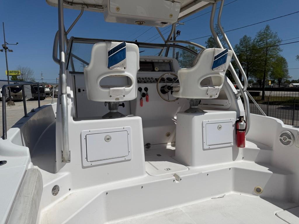 2000 Pro-Line 27 Walk boat interior with dual seats and control panel.