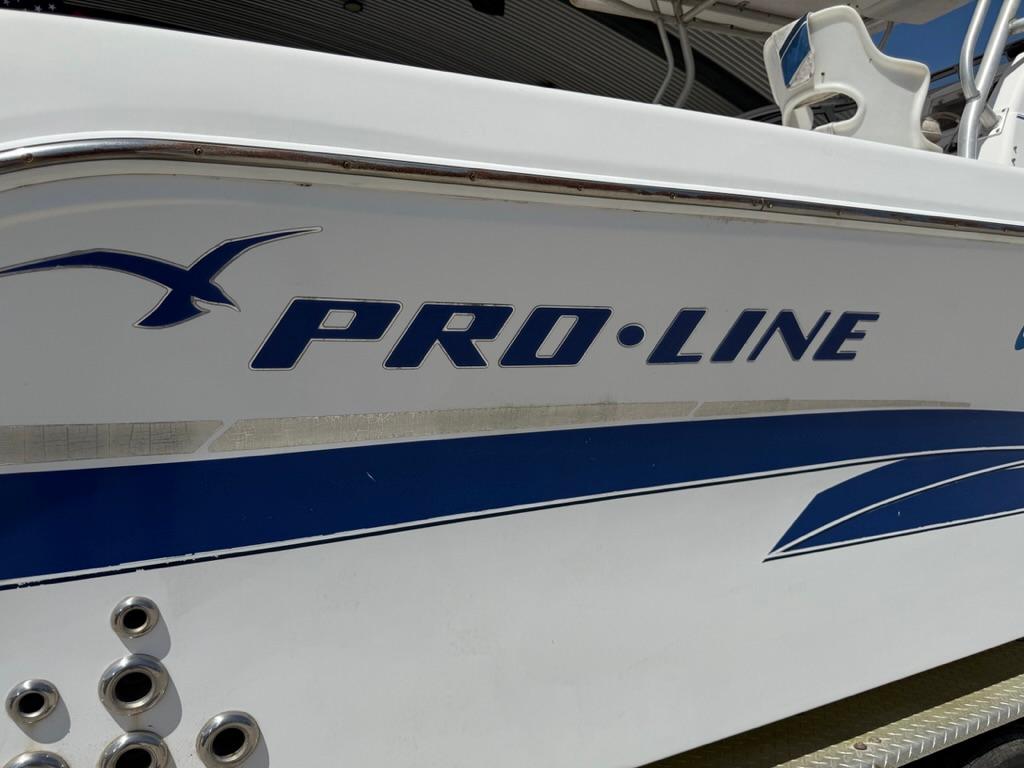 2000 Pro-Line 27 Walk boat side view with logo and design details.
