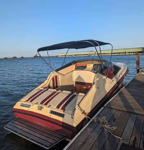 1980 Tahiti Ocean Racer boat docked on calm water under clear blue sky.