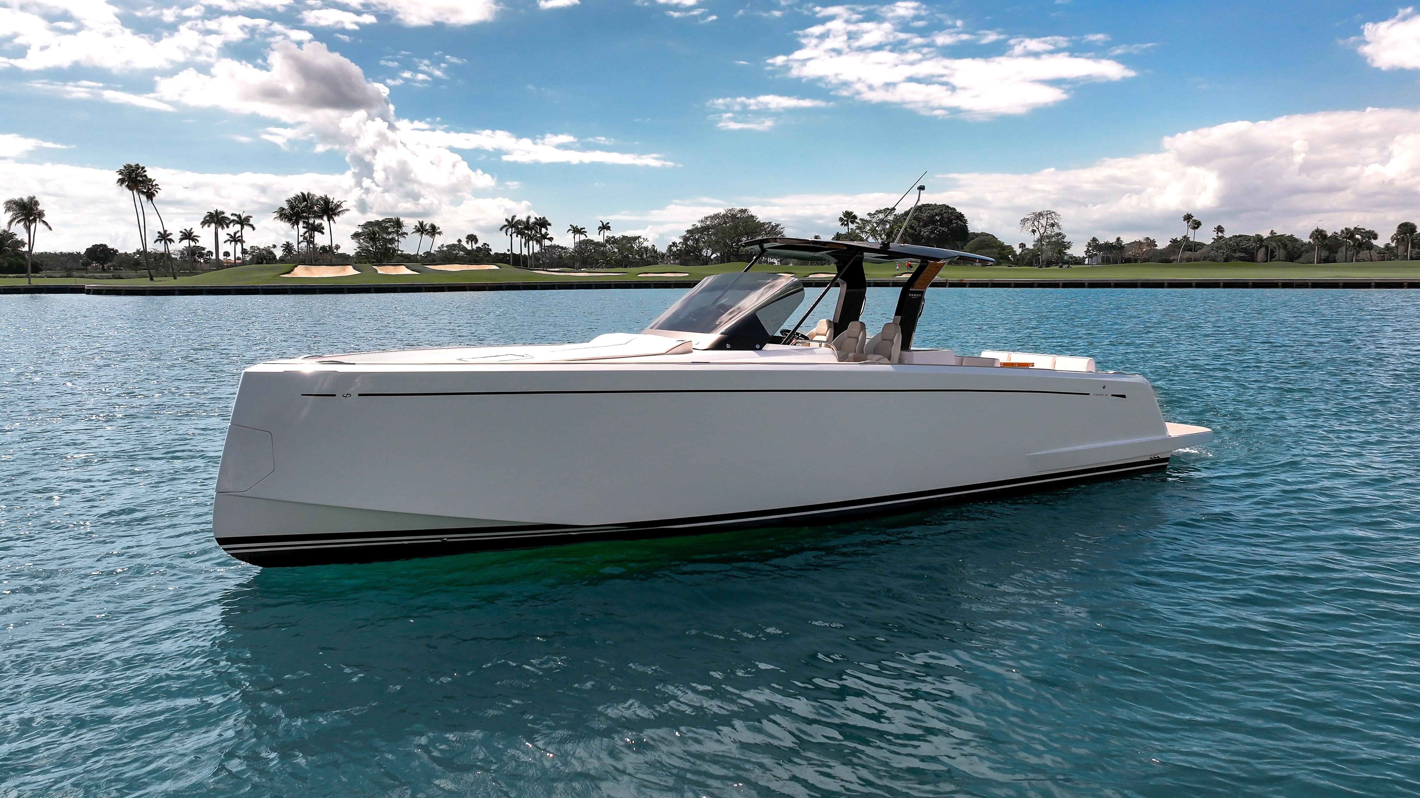 2025 Pardo Yachts 38 cruising on a sunny day with palm trees in the background.