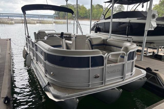 2017 South Bay 222 RS pontoon boat docked on a calm lake.