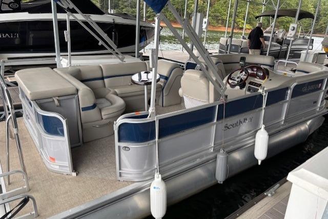 2017 South Bay 222 RS pontoon boat docked, featuring spacious seating and modern design.