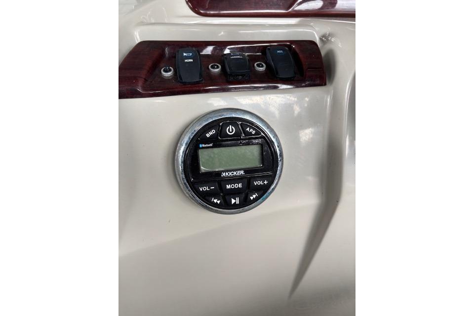 Control panel of 2017 South Bay 222 RS boat with Kicker audio system.