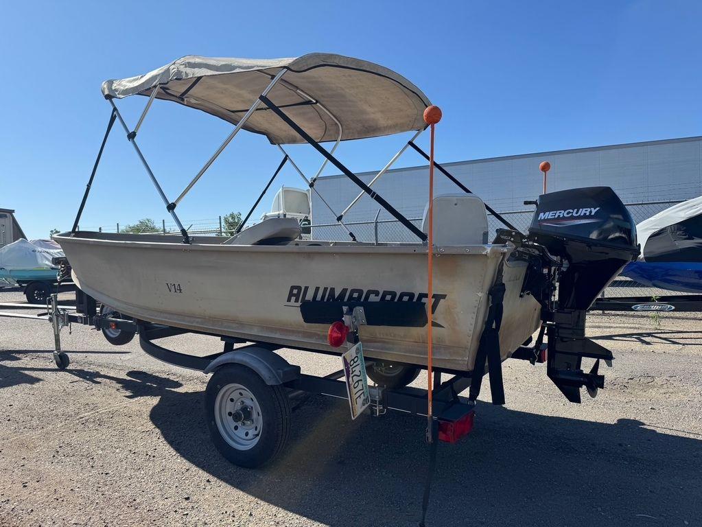 2003 Alumacraft V14 boat with Mercury outboard motor on trailer.