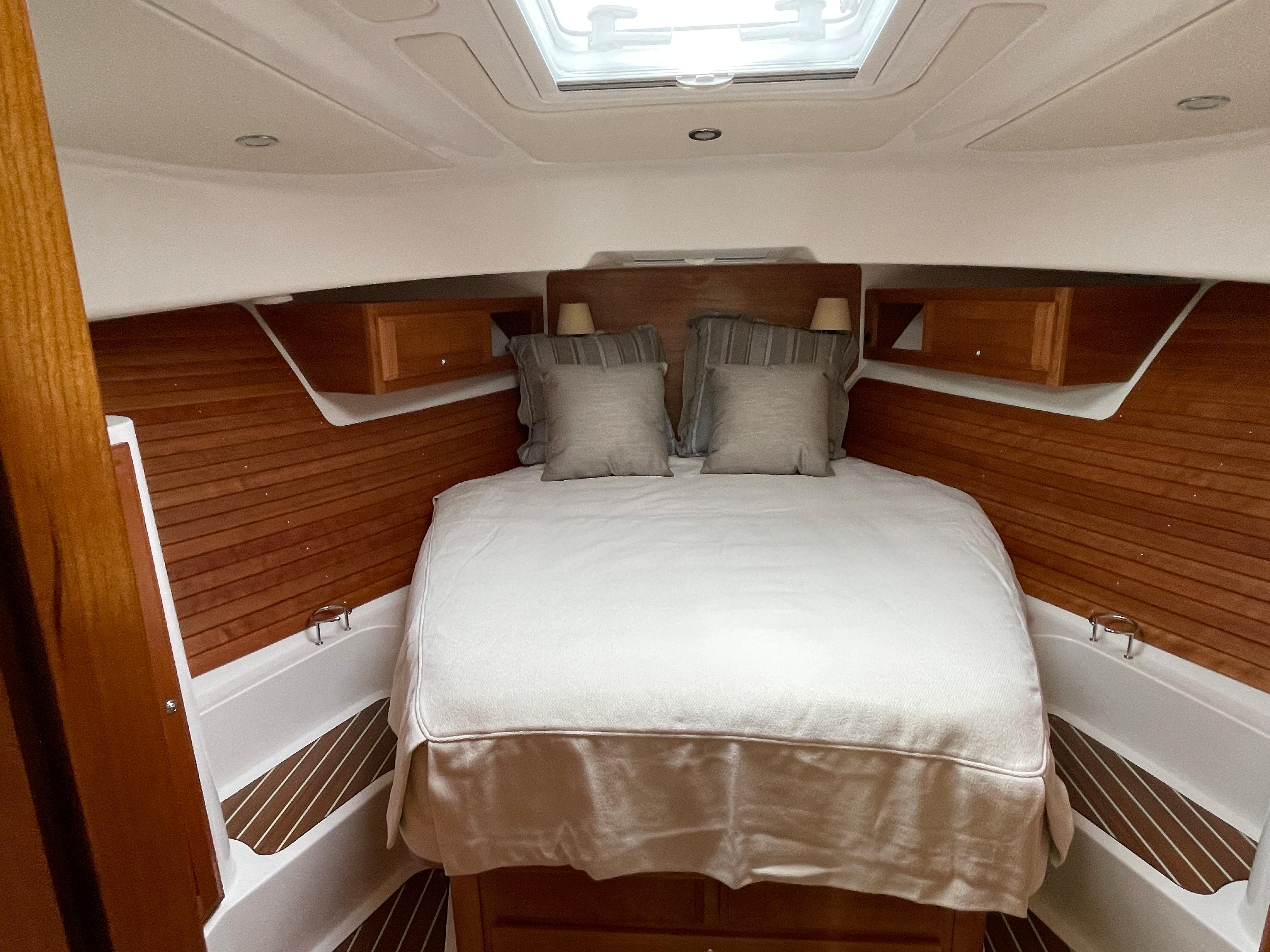 39 ft Back Cove 39O Master stateroom with custom bedding