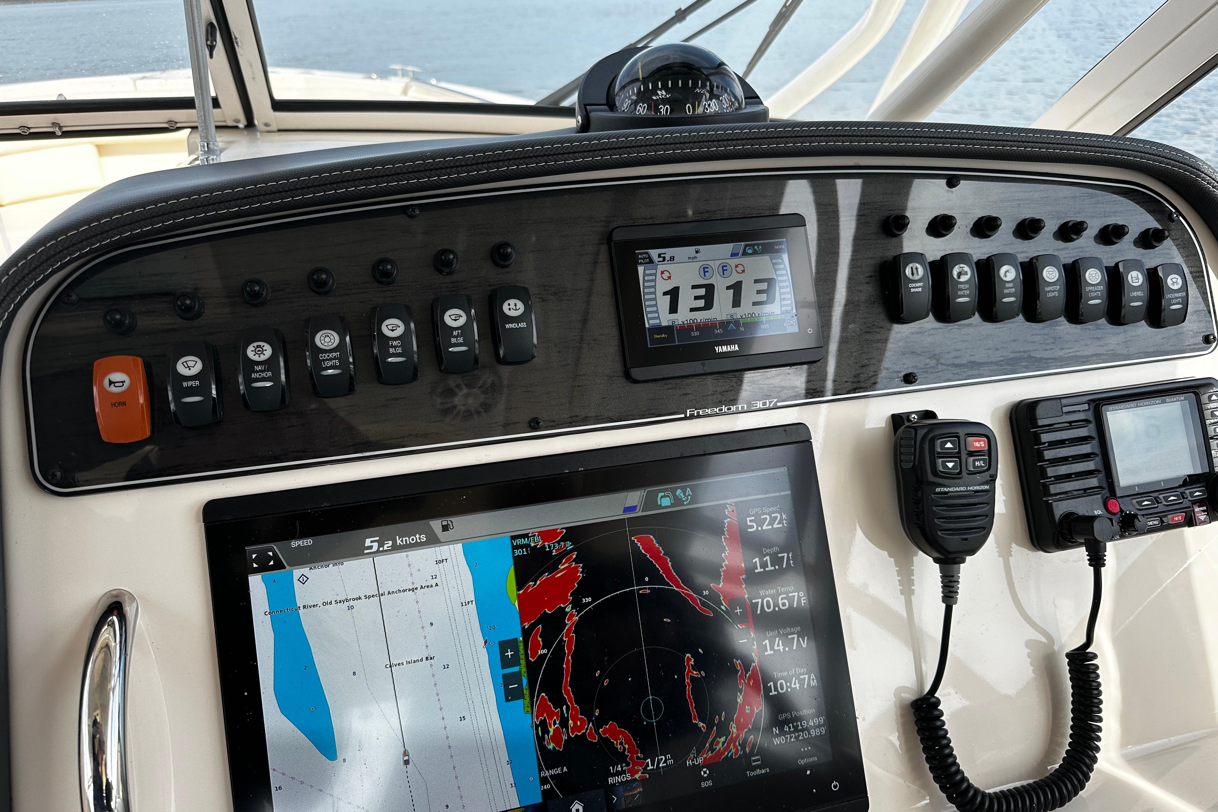 Dashboard of 2023 Grady-White Freedom 307 boat with navigation and communication equipment.
