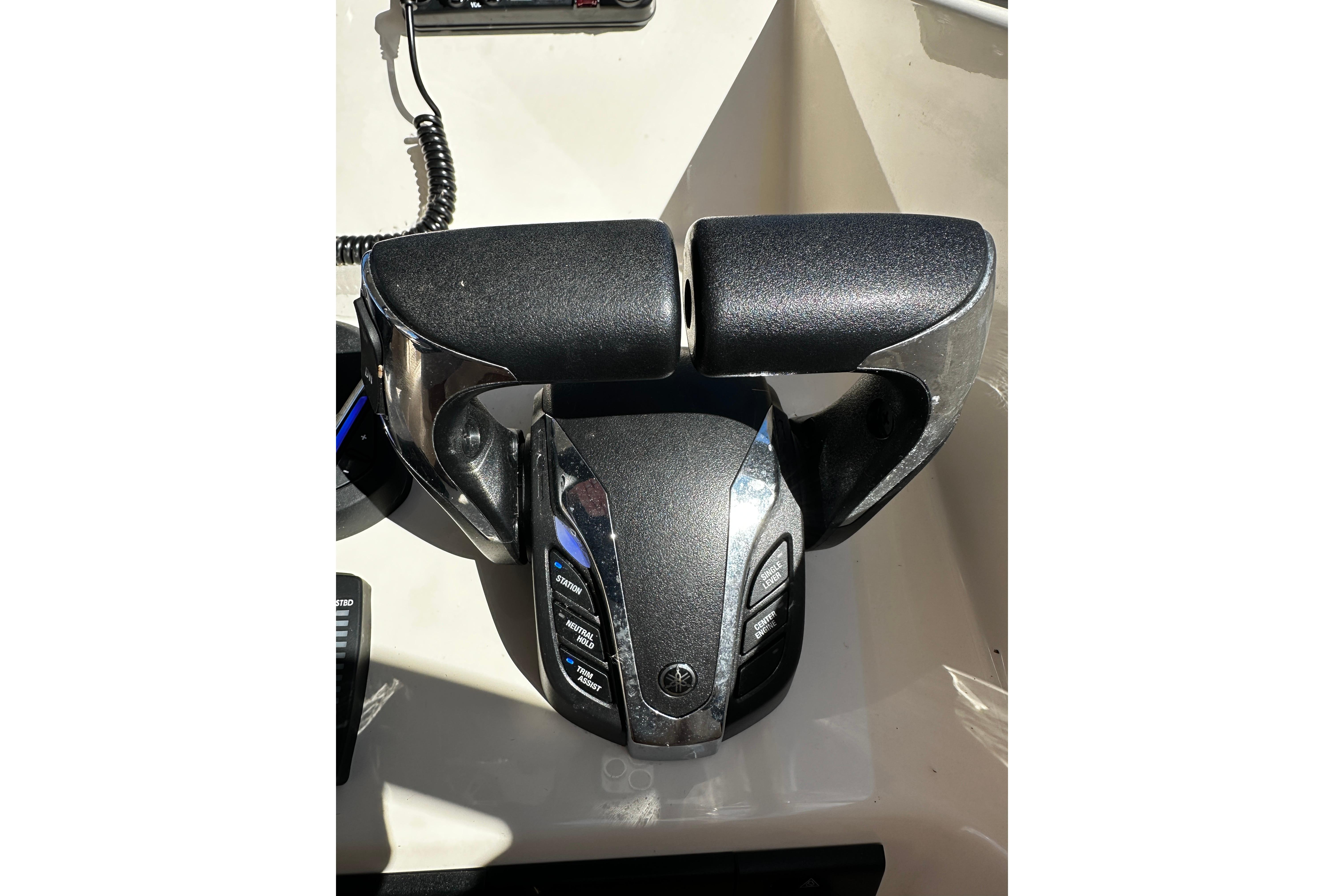 Throttle controls on a 2023 Grady-White Freedom 307 boat dashboard.