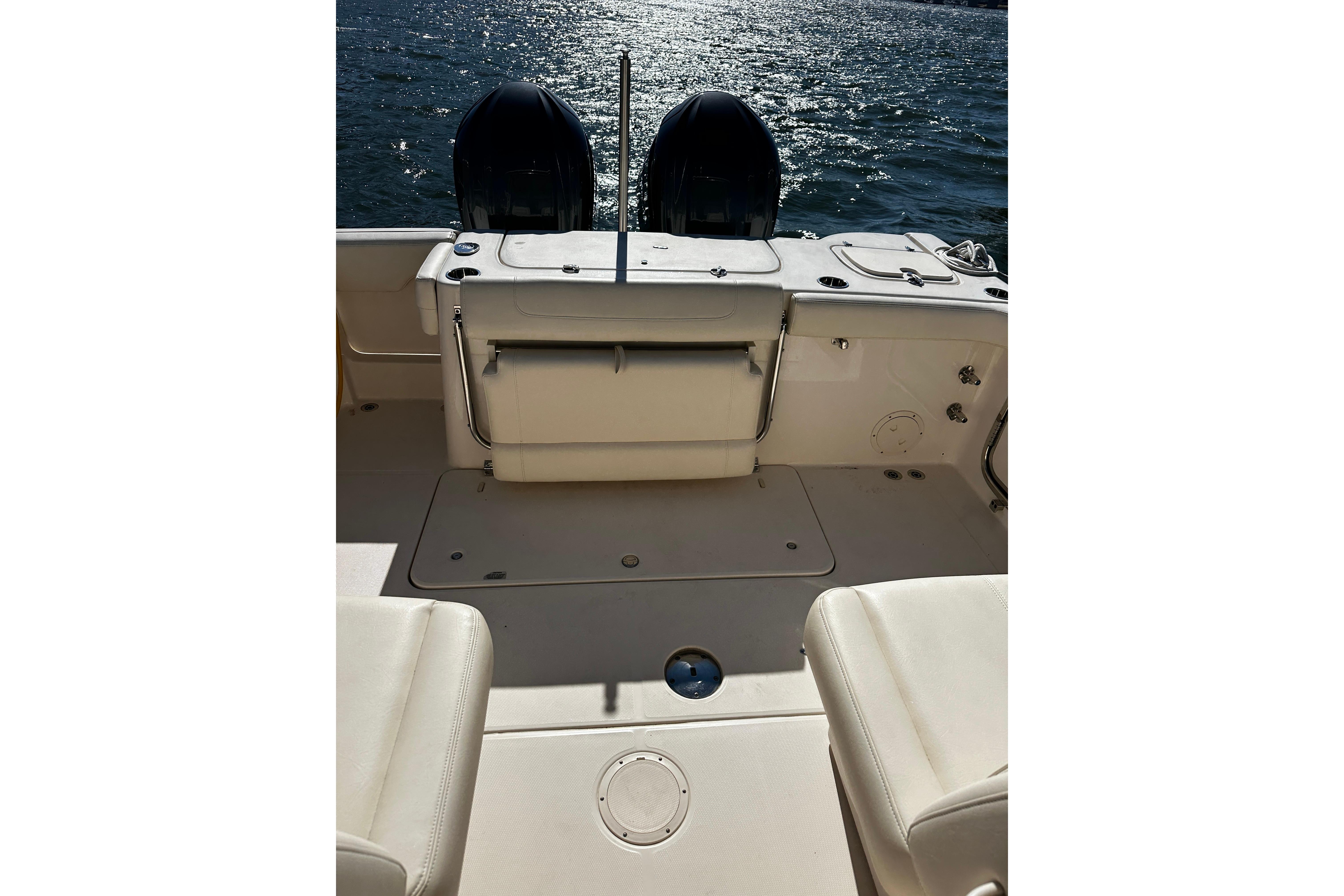 2023 Grady-White Freedom 307 boat interior with dual engines on water.
