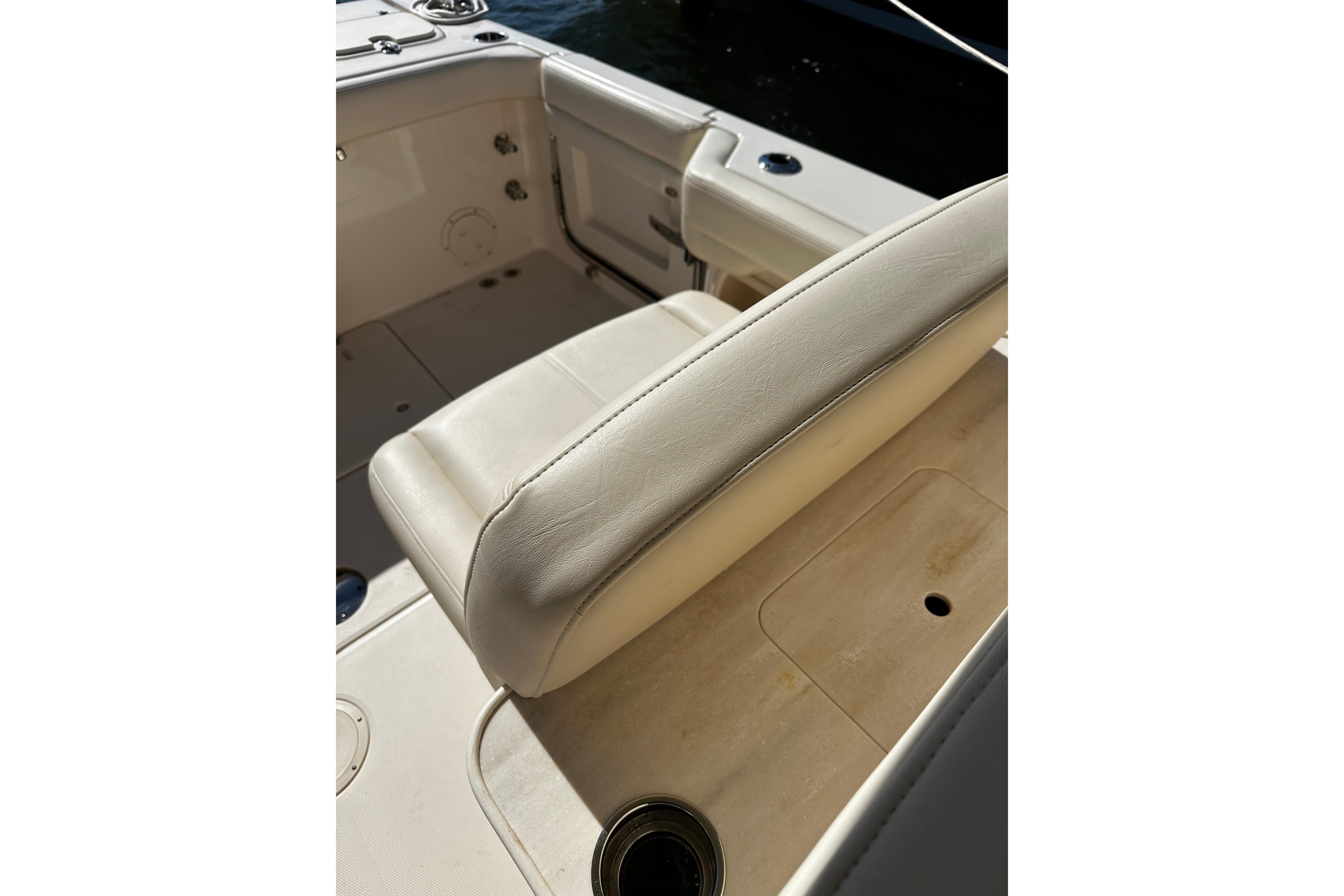 2023 Grady-White Freedom 307 boat interior with beige seating and cup holder.