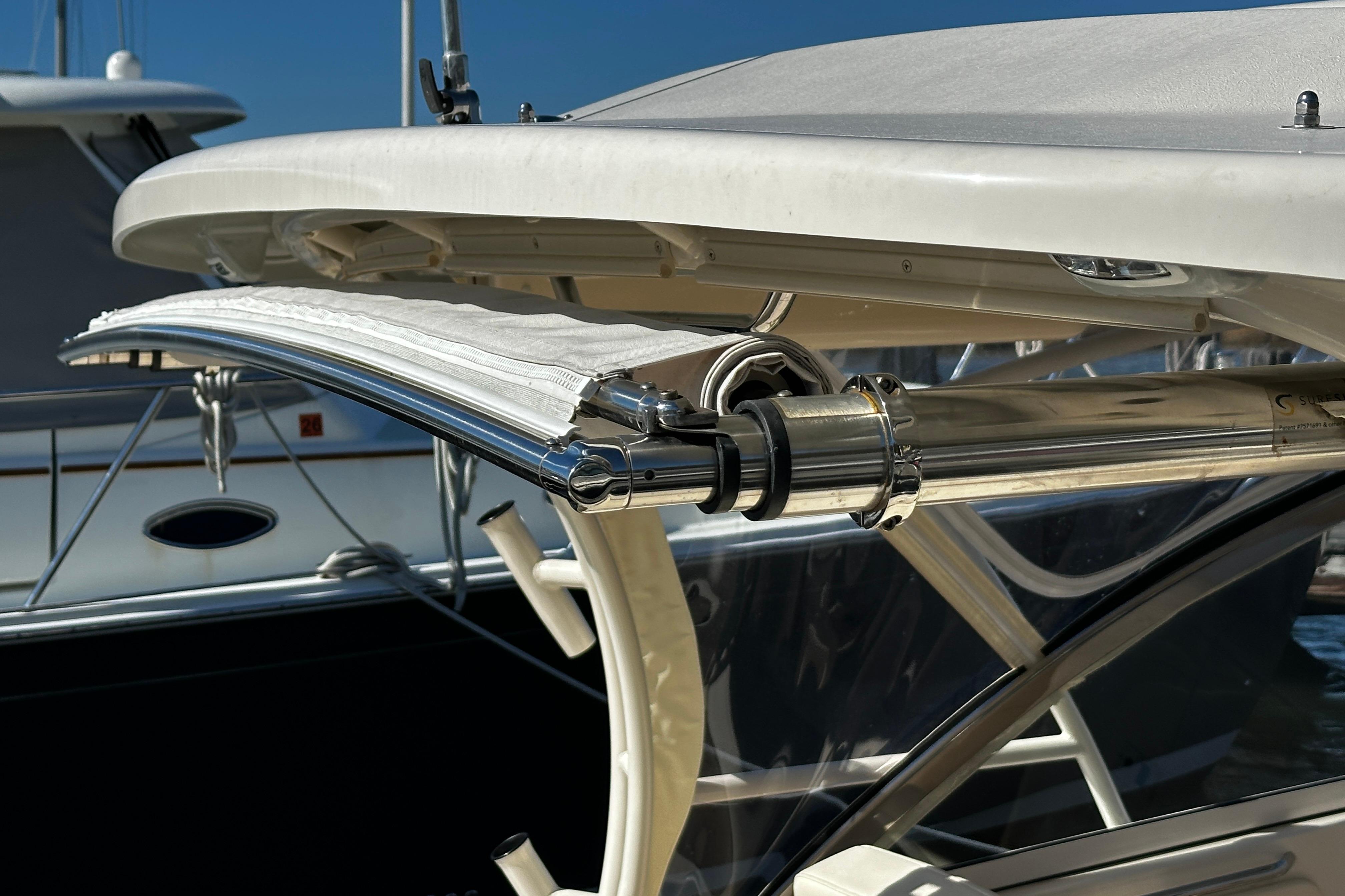 2023 Grady-White Freedom 307 boat with stainless steel fittings and canopy detail.