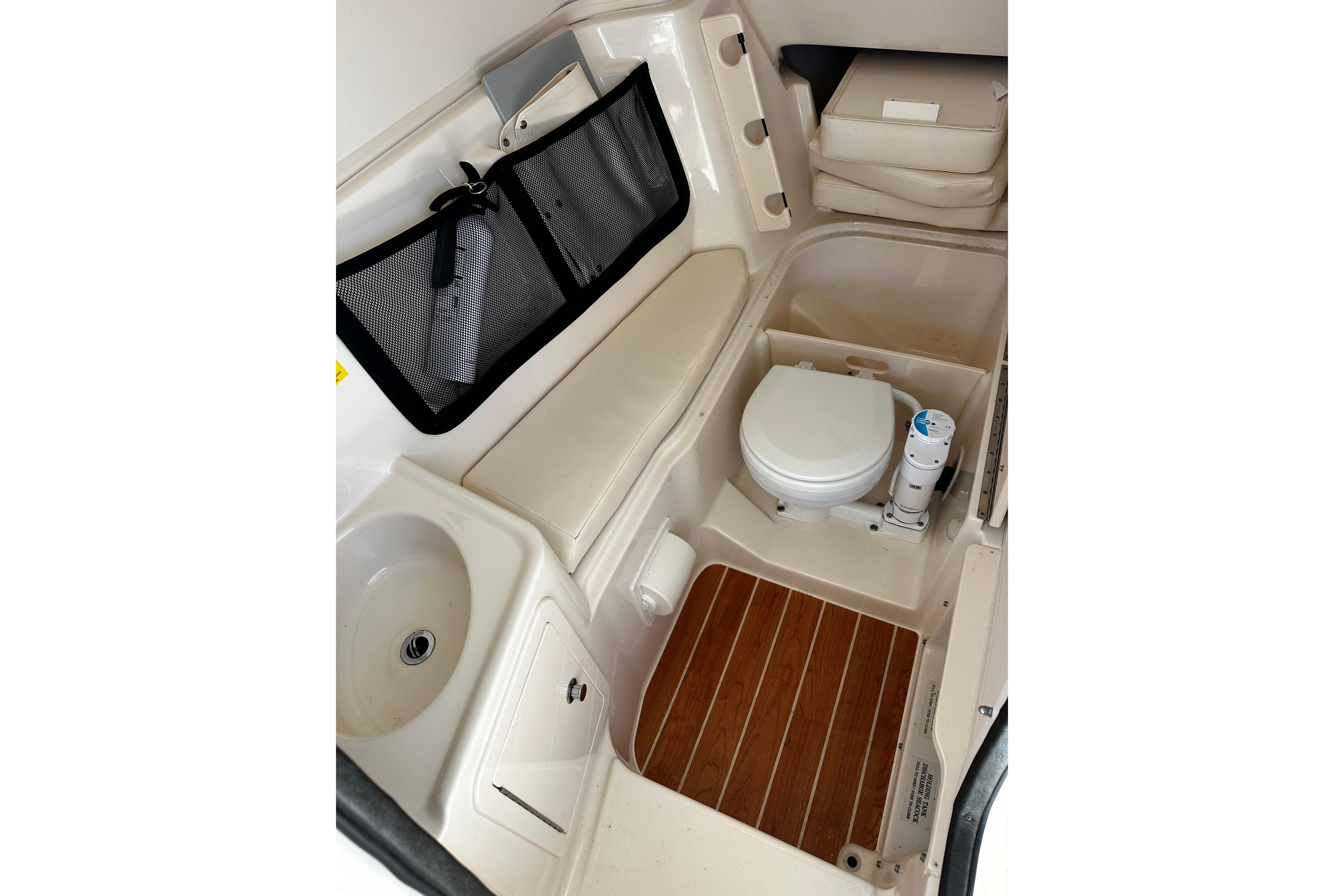 2023 Grady-White Freedom 307 boat interior with toilet and sink.