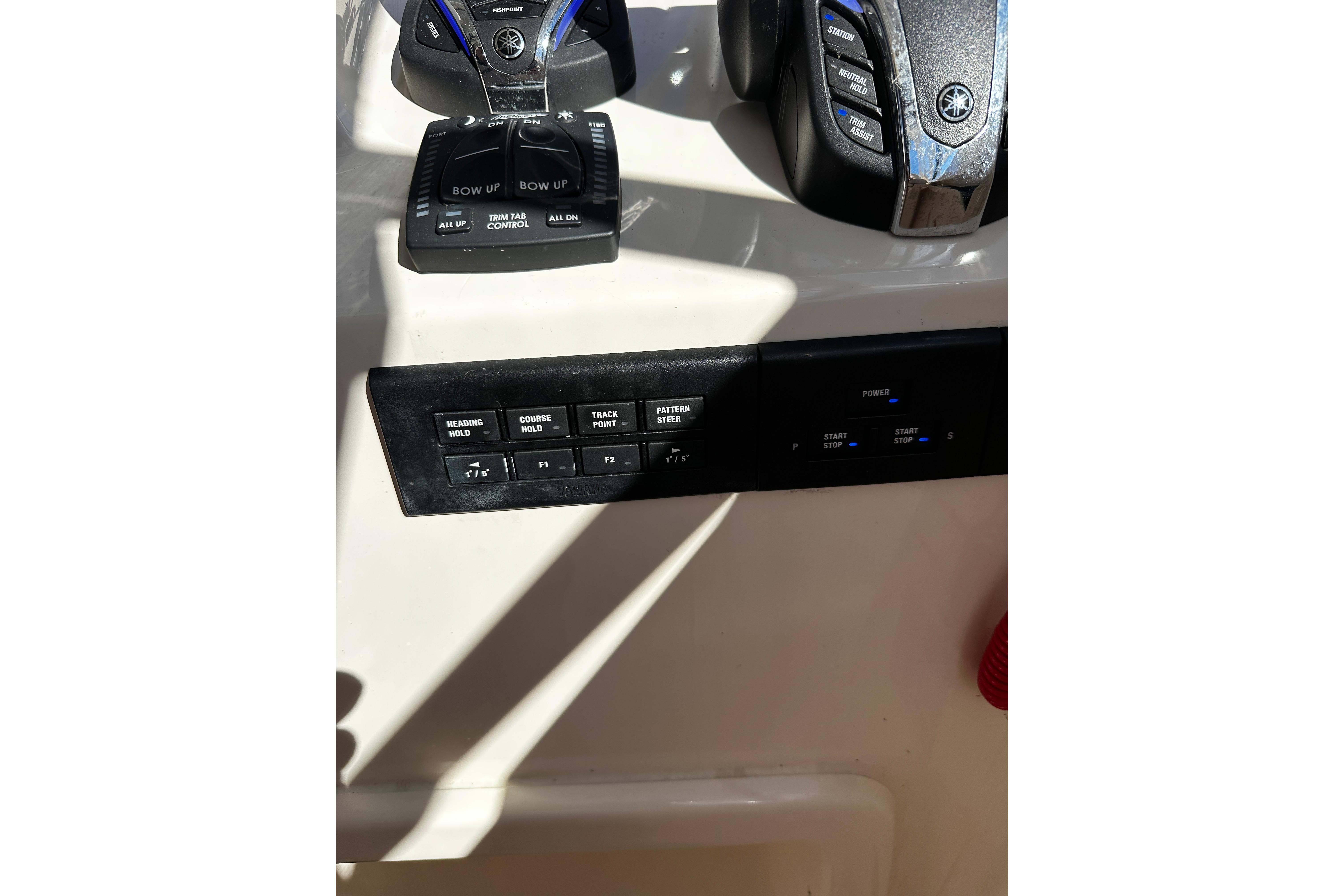 Control panel of 2023 Grady-White Freedom 307 boat, featuring navigation and power controls.