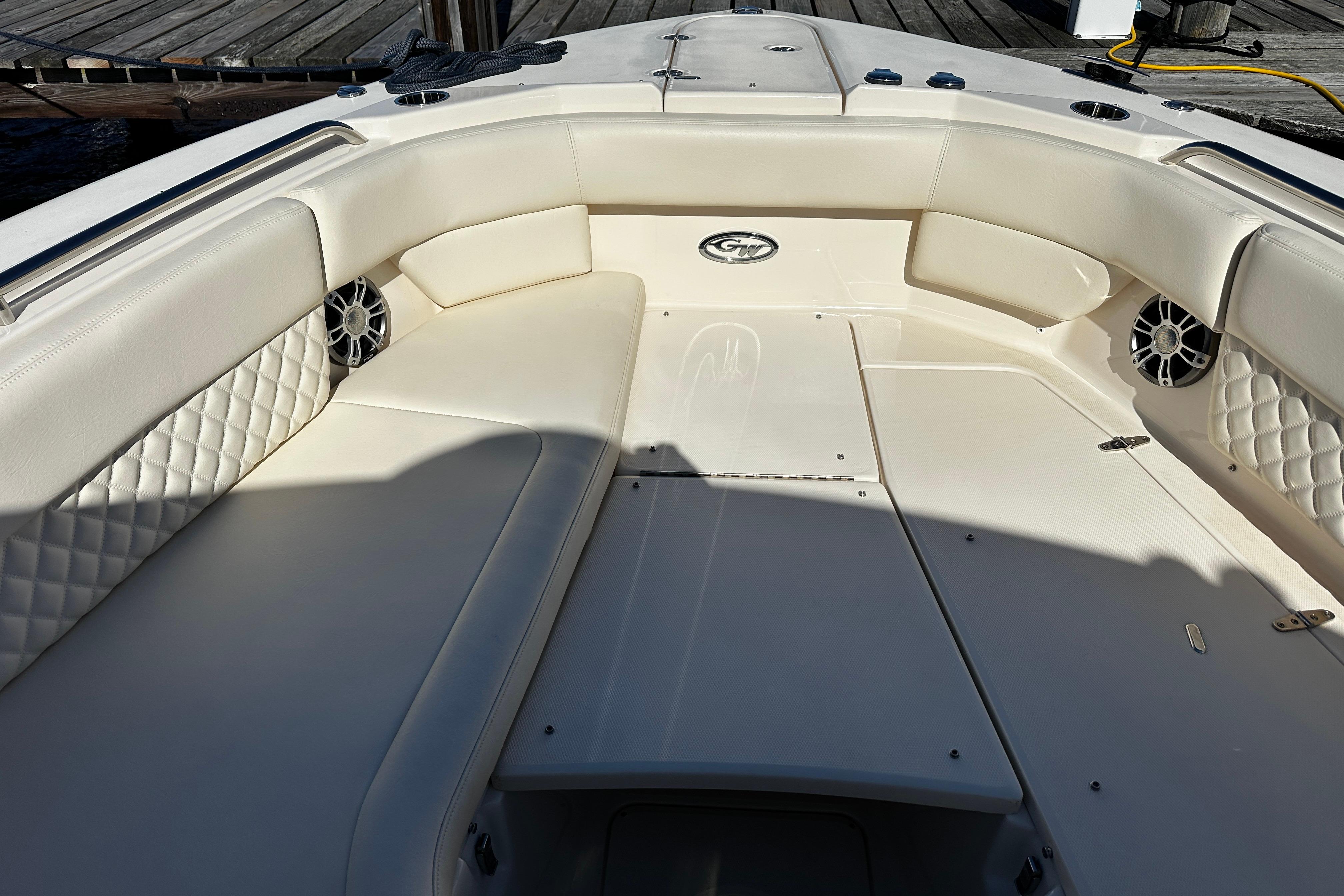 2023 Grady-White Freedom 307 boat interior with cushioned seating and speakers.