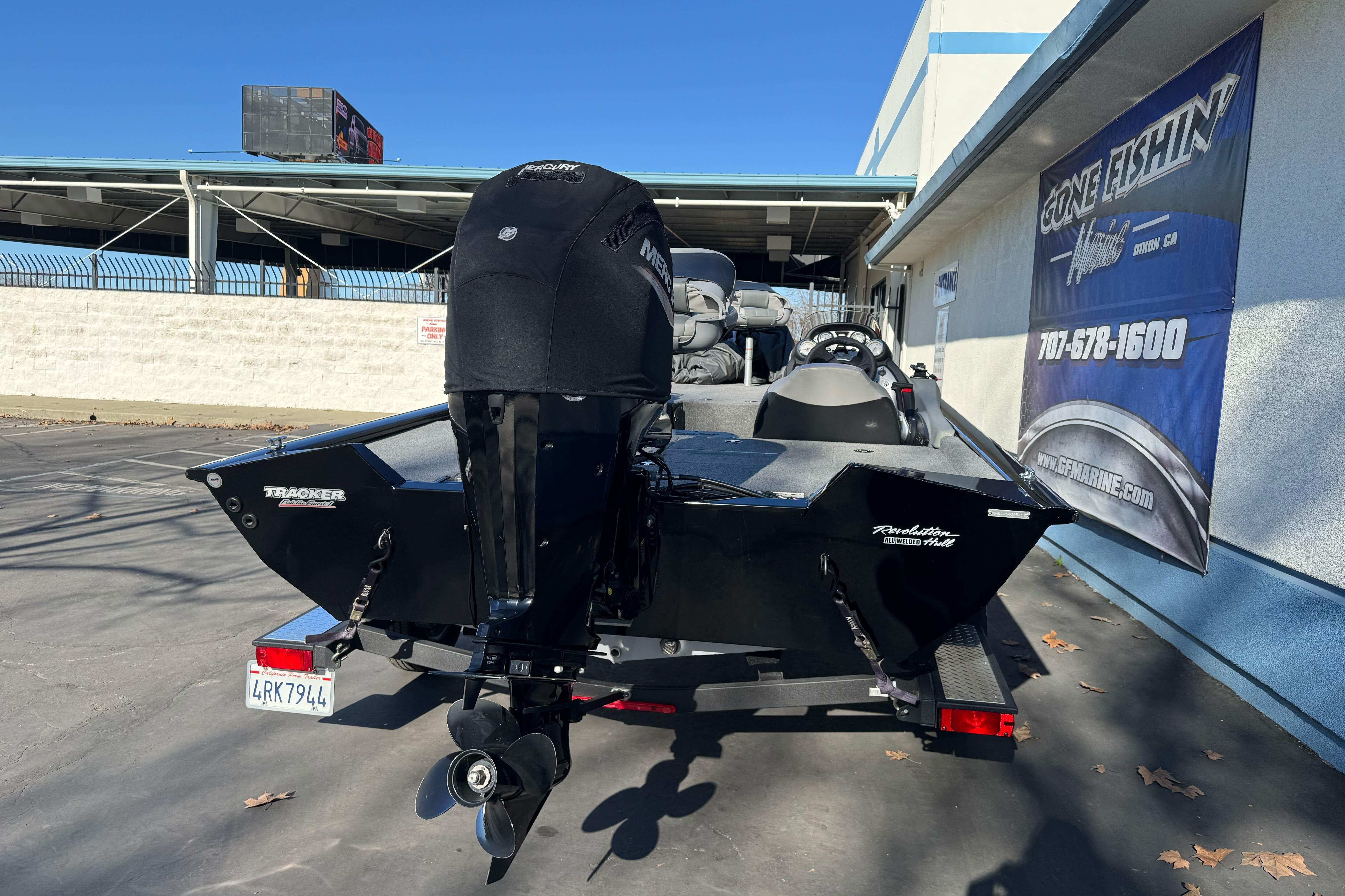 2017 Tracker Pro Team 195 TXW boat with Mercury engine, parked outdoors.