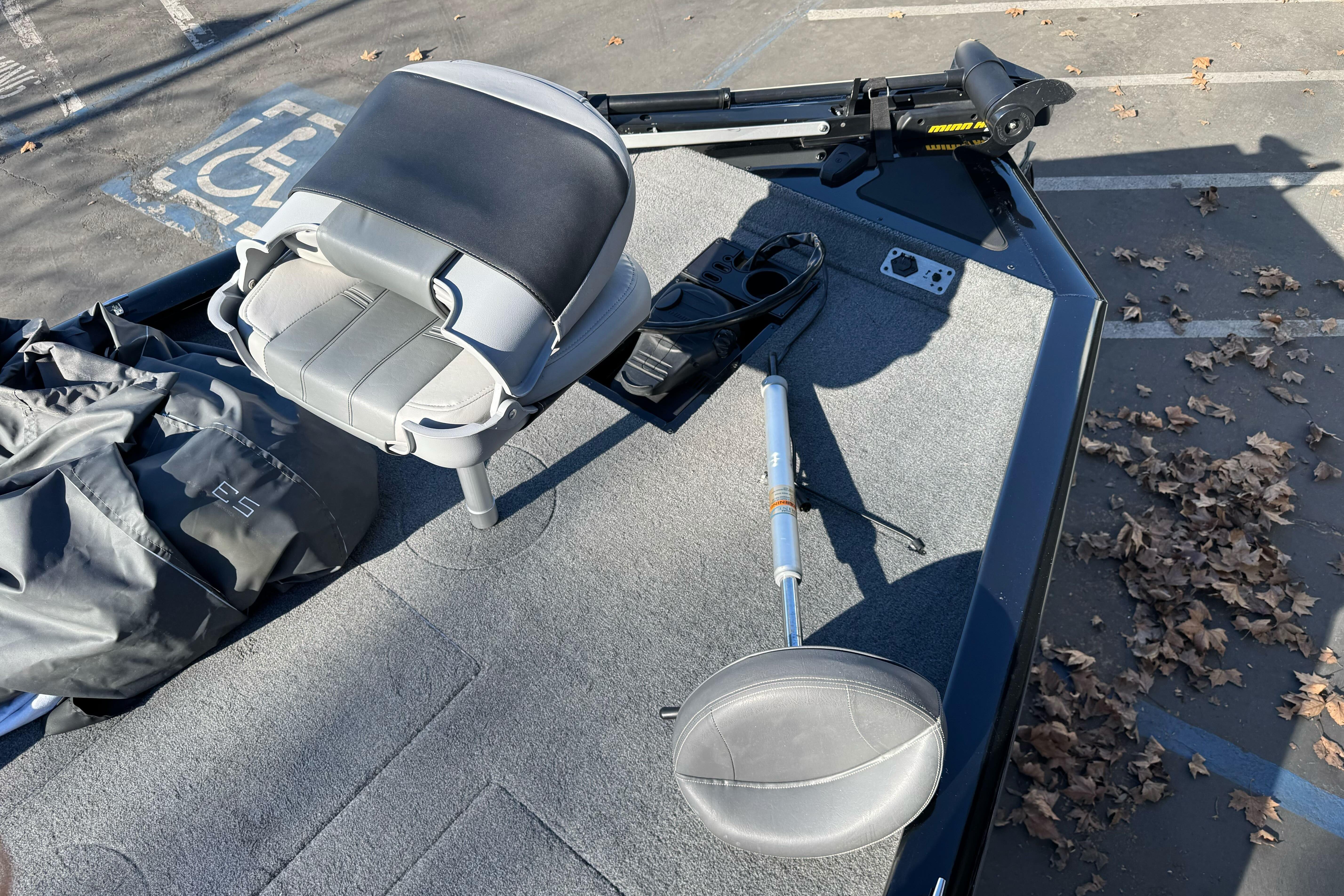 2017 Tracker Pro Team 195 TXW boat interior with seat and equipment on deck.