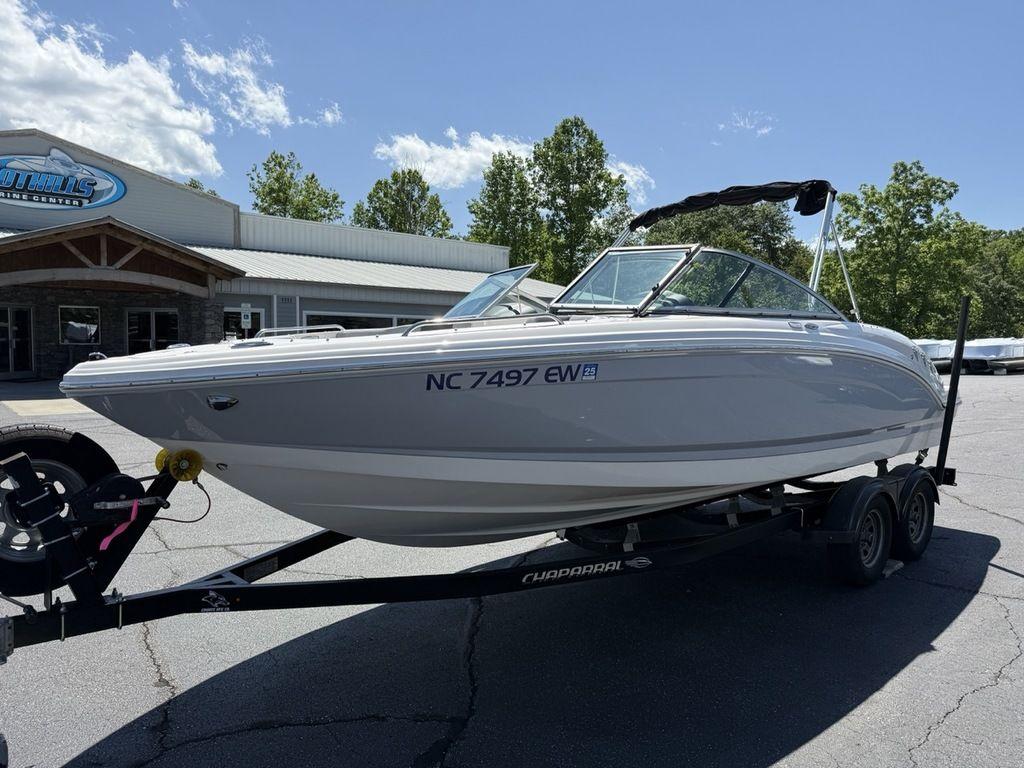2022 Chaparral 23 SSi boat on trailer outside dealership, sunny day.