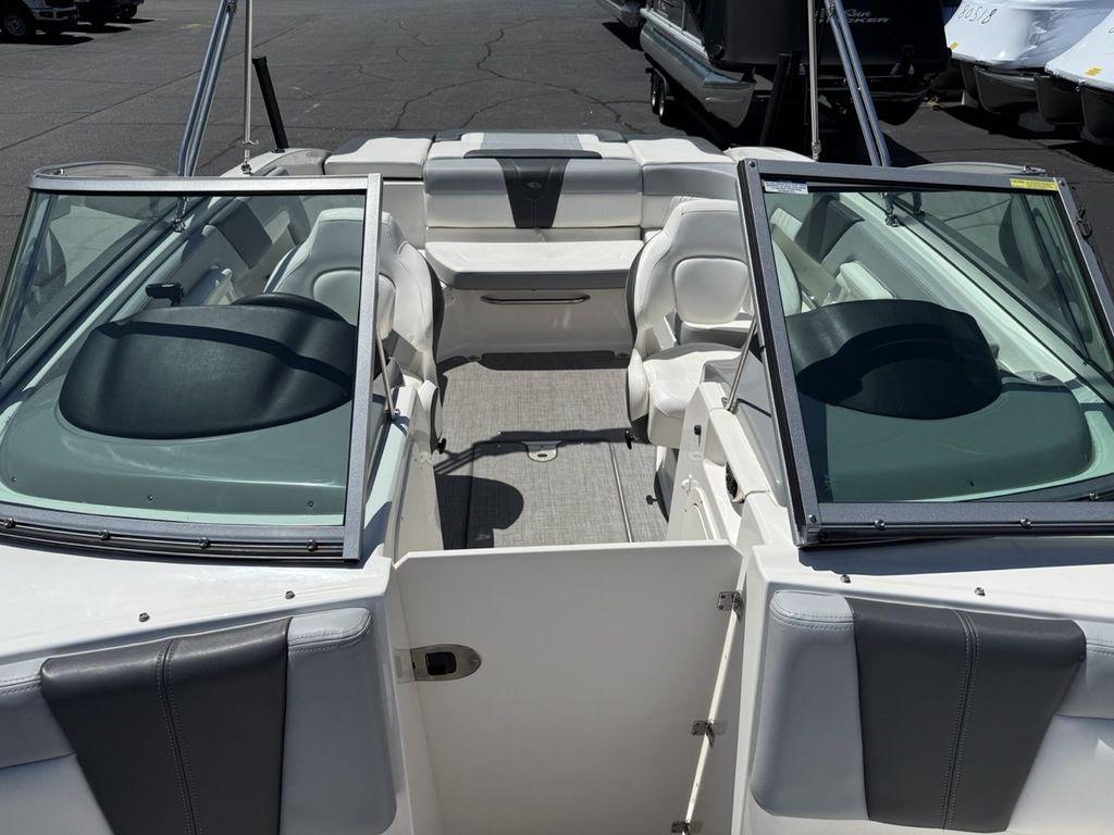 2022 Chaparral 23 SSi boat interior with open seating and windshield.