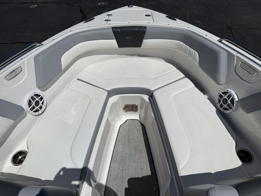 2022 Chaparral 23 SSi boat interior with white seating and speakers.