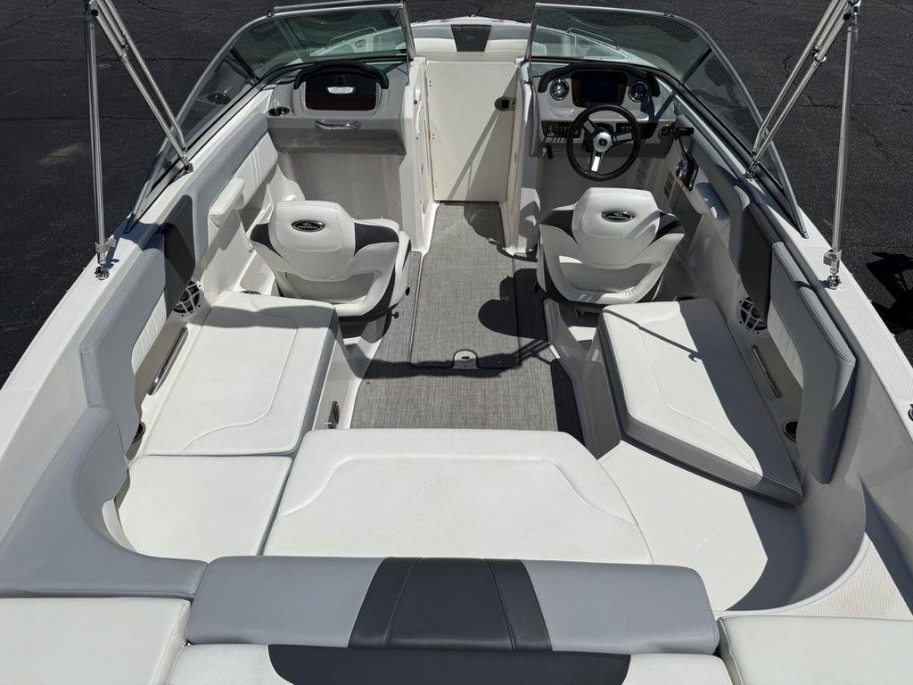 2022 Chaparral 23 SSi boat interior with white seating and steering console.