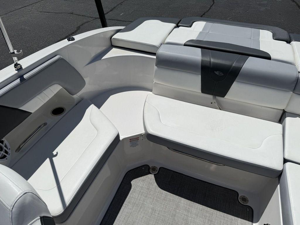 2022 Chaparral 23 SSi boat interior with white seating and cup holder.