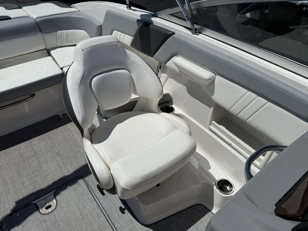 2022 Chaparral 23 SSi boat interior with white seating and modern design.