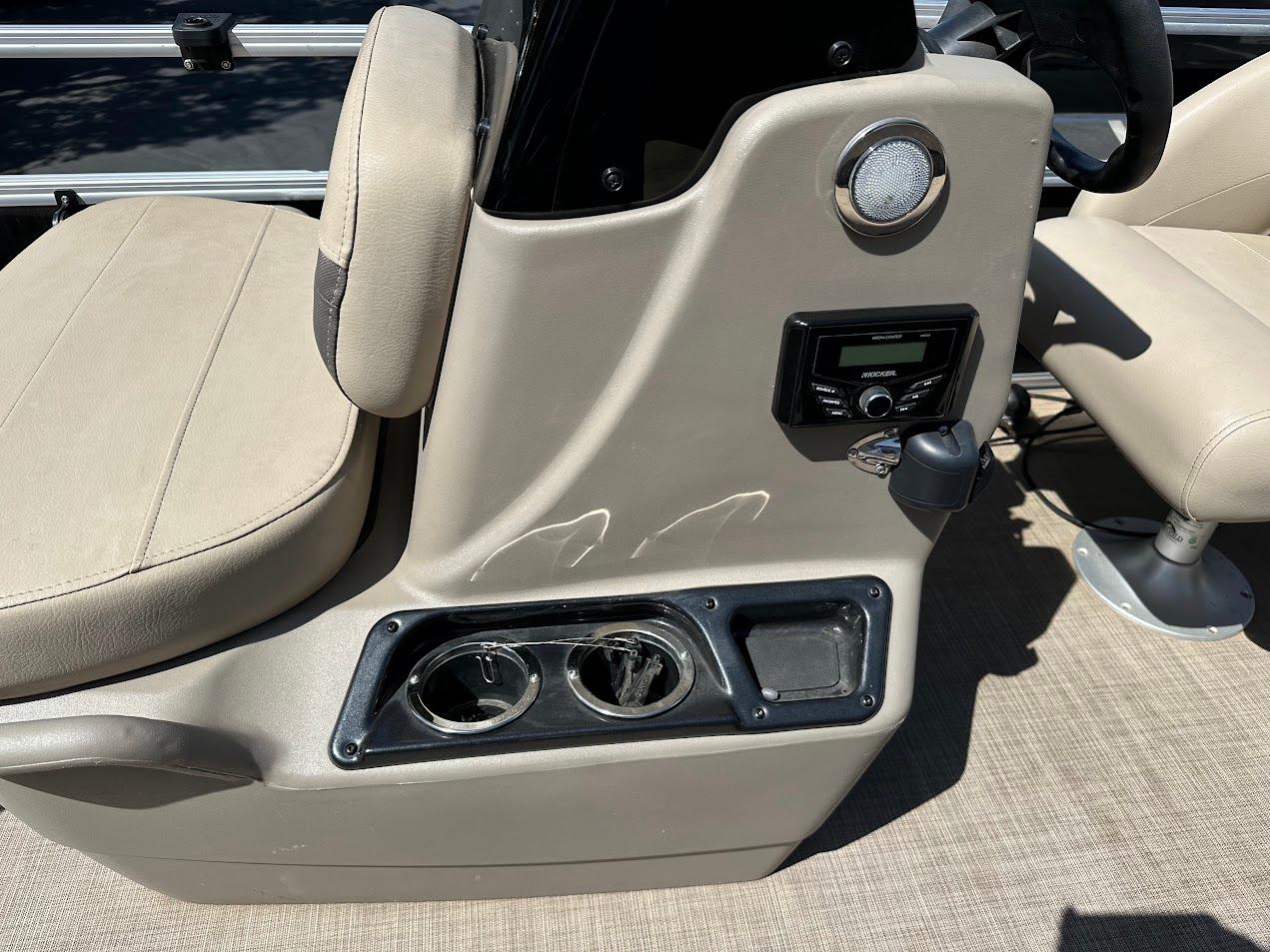 2022 Sun Tracker Bass Buggy 16 XL Select boat interior with beige seating and control panel.