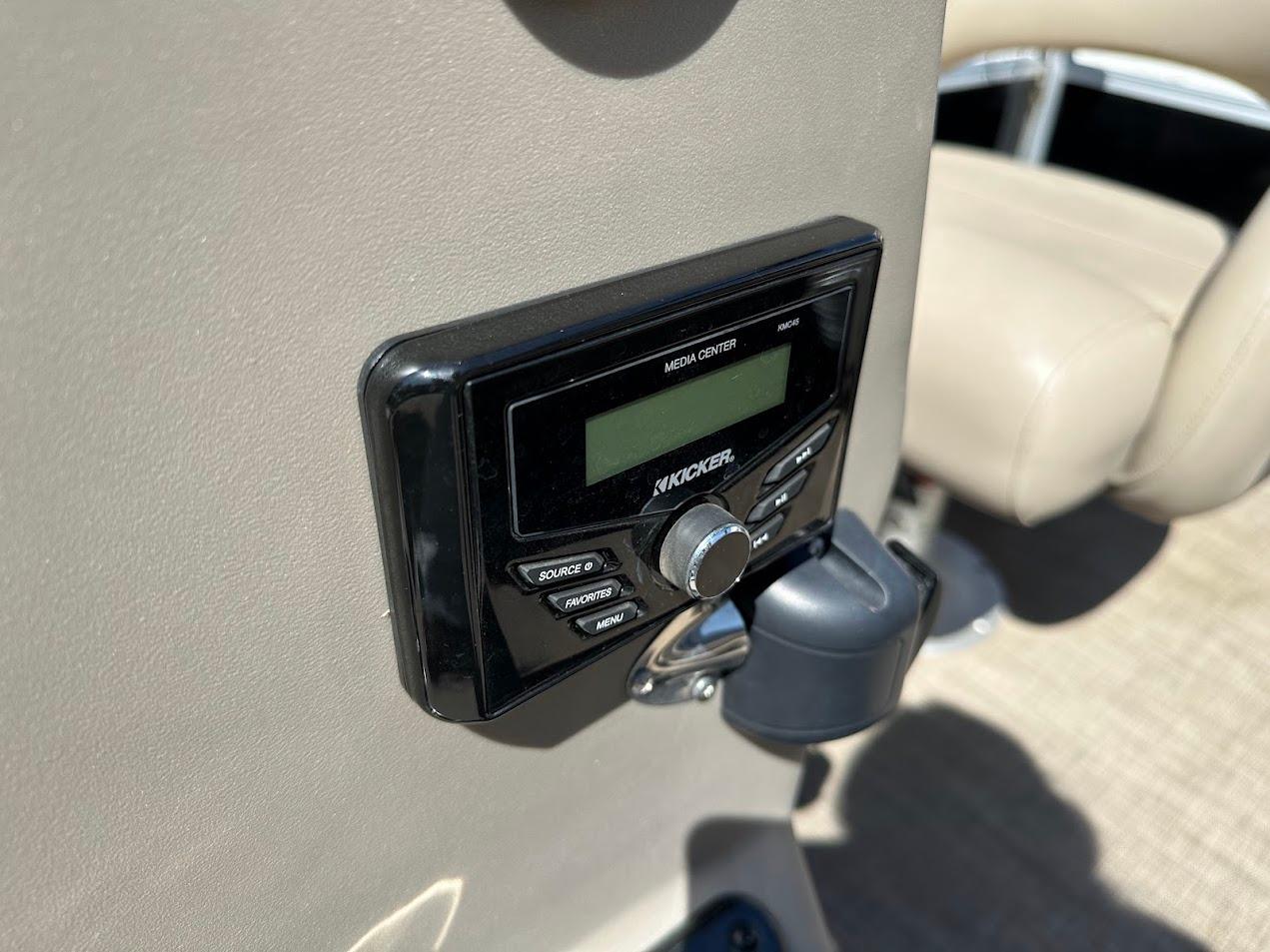 Kicker stereo system on 2022 Sun Tracker Bass Buggy 16 XL Select boat dashboard.