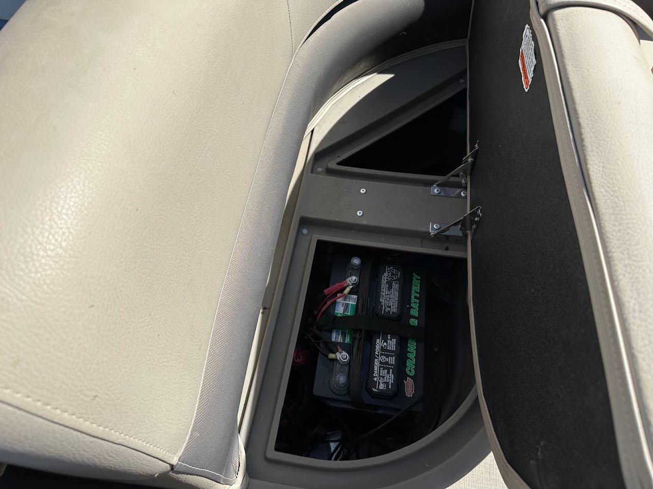 Battery compartment of 2022 Sun Tracker Bass Buggy 16 XL Select pontoon boat.