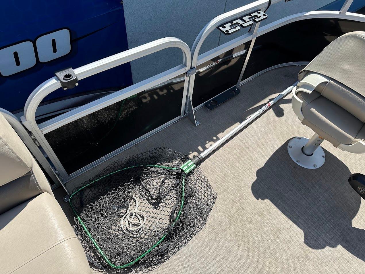 2022 Sun Tracker Bass Buggy 16 XL Select deck with fishing net and seating.