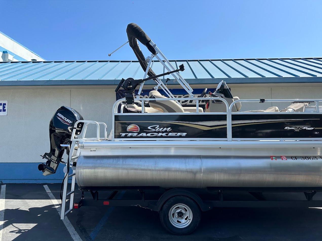 2022 Sun Tracker Bass Buggy 16 XL Select pontoon boat on trailer.