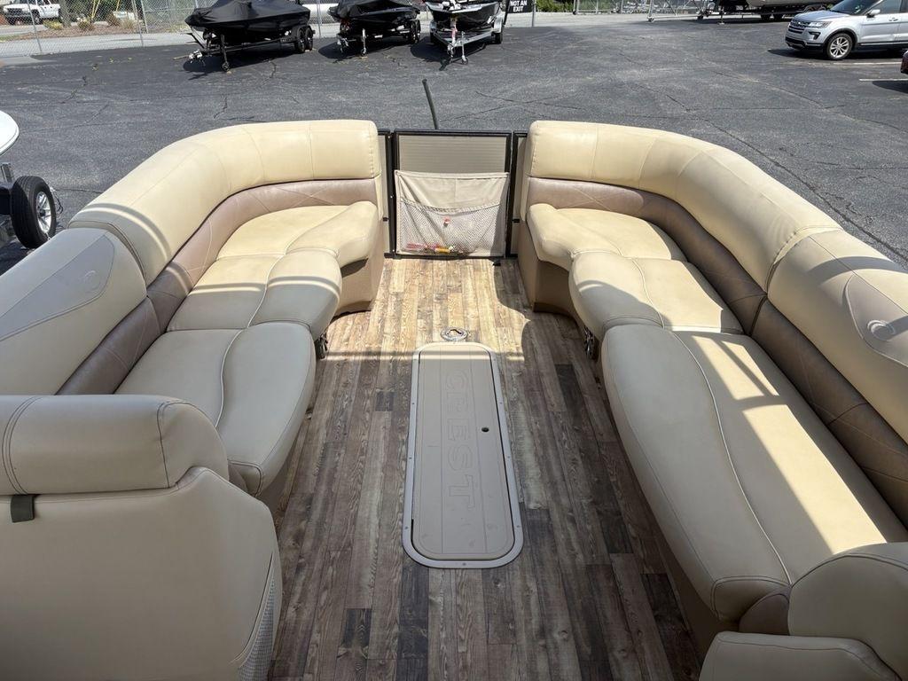 2017 Crest Classic 250L USD CP3 pontoon boat with beige seating and wood-style flooring.