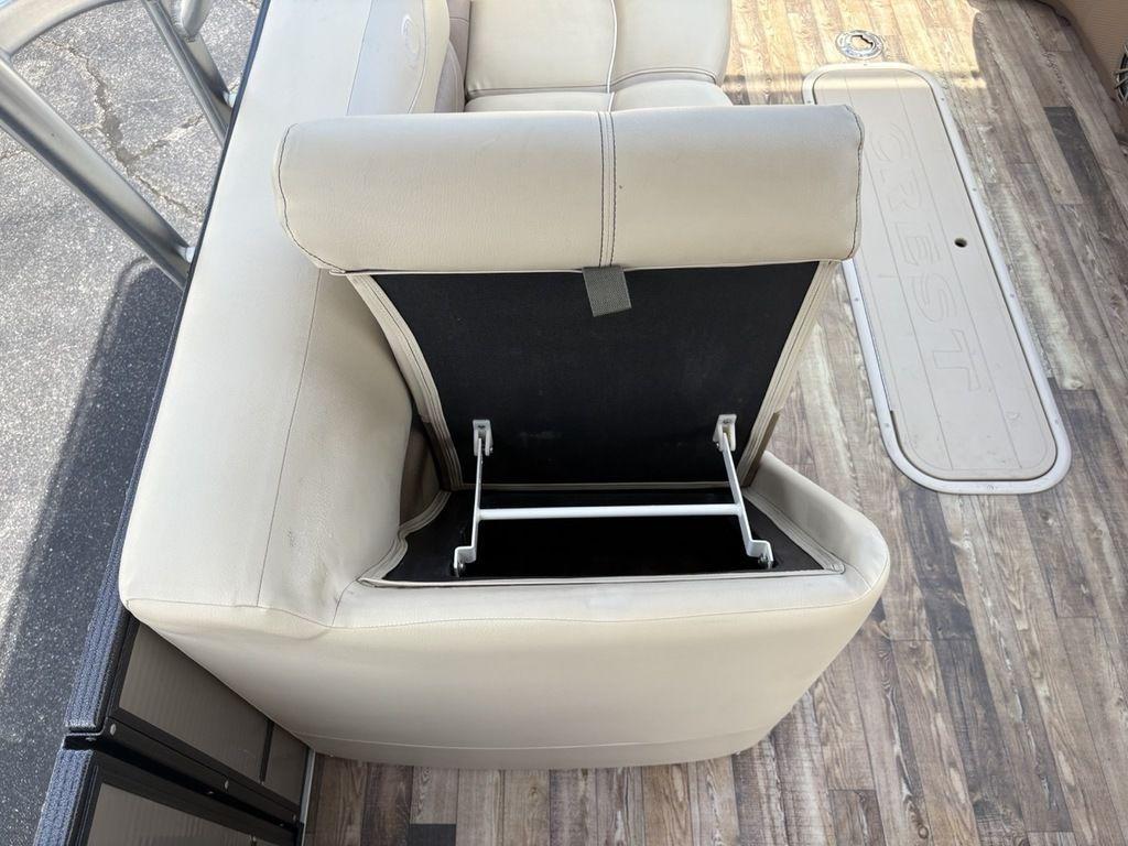 2017 Crest Classic 250L USD CP3 boat seat with open storage compartment.