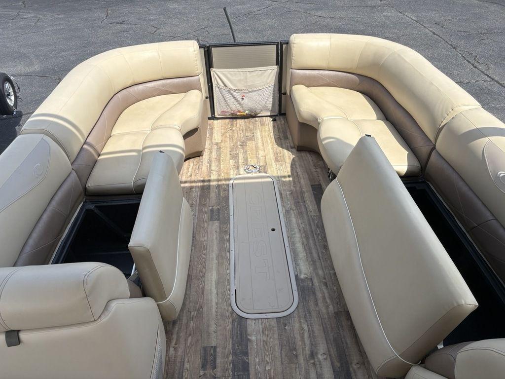 2017 Crest Classic 250L USD CP3 pontoon boat with beige seating and wood-style flooring.