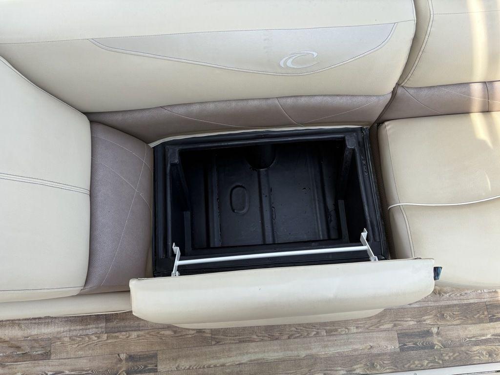2017 Crest Classic 250L USD CP3 boat seat with open storage compartment.