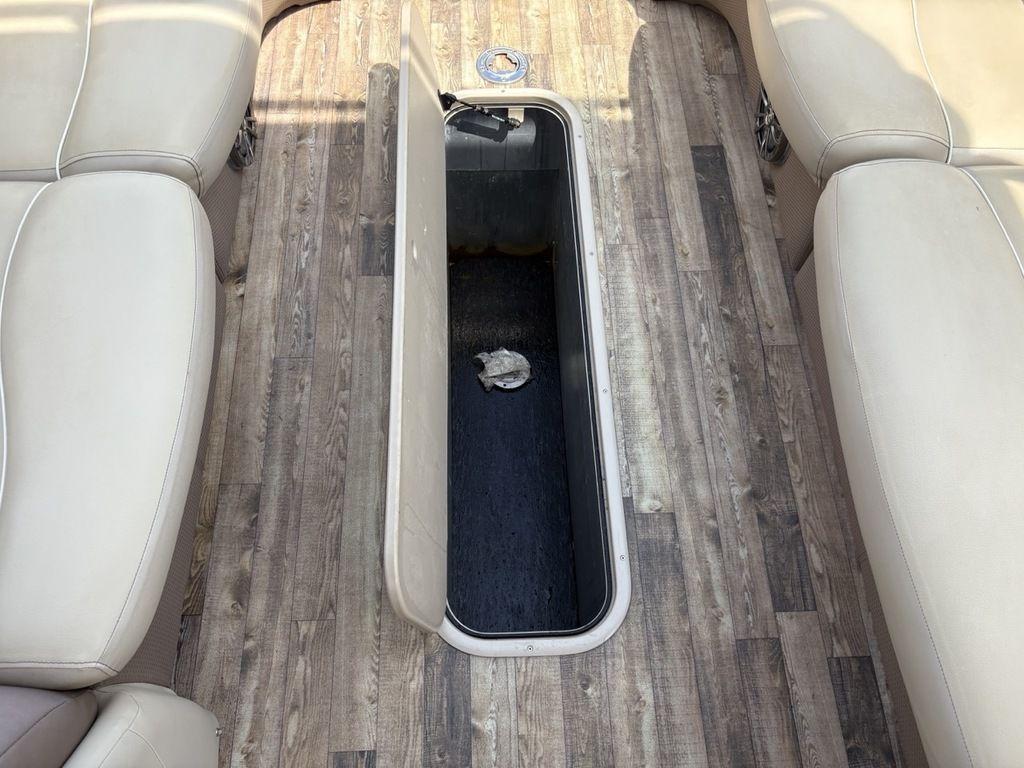 2017 Crest Classic 250L USD CP3 boat interior with open storage compartment and beige seating.