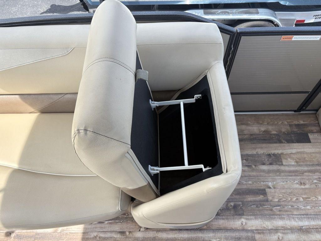 2017 Crest Classic 250L USD CP3 boat seat with open storage compartment.