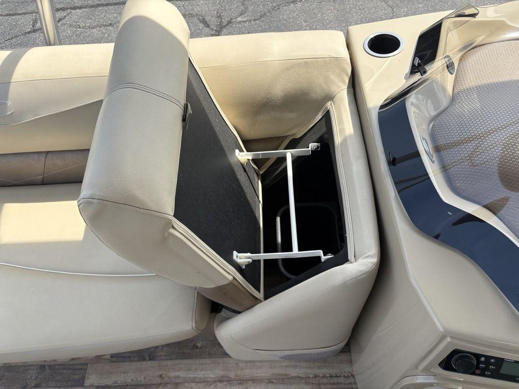 2017 Crest Classic 250L USD CP3 boat interior with open storage compartment and cup holder.