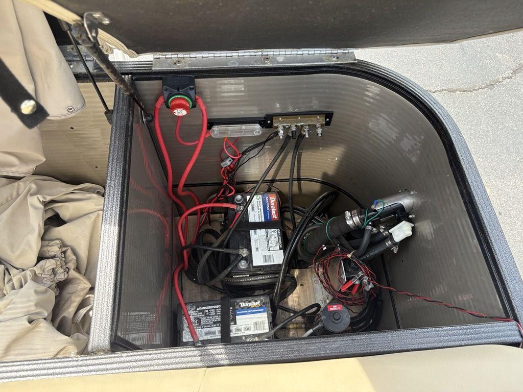 Open battery compartment of 2017 Crest Classic 250L USD CP3 with wiring and components visible.
