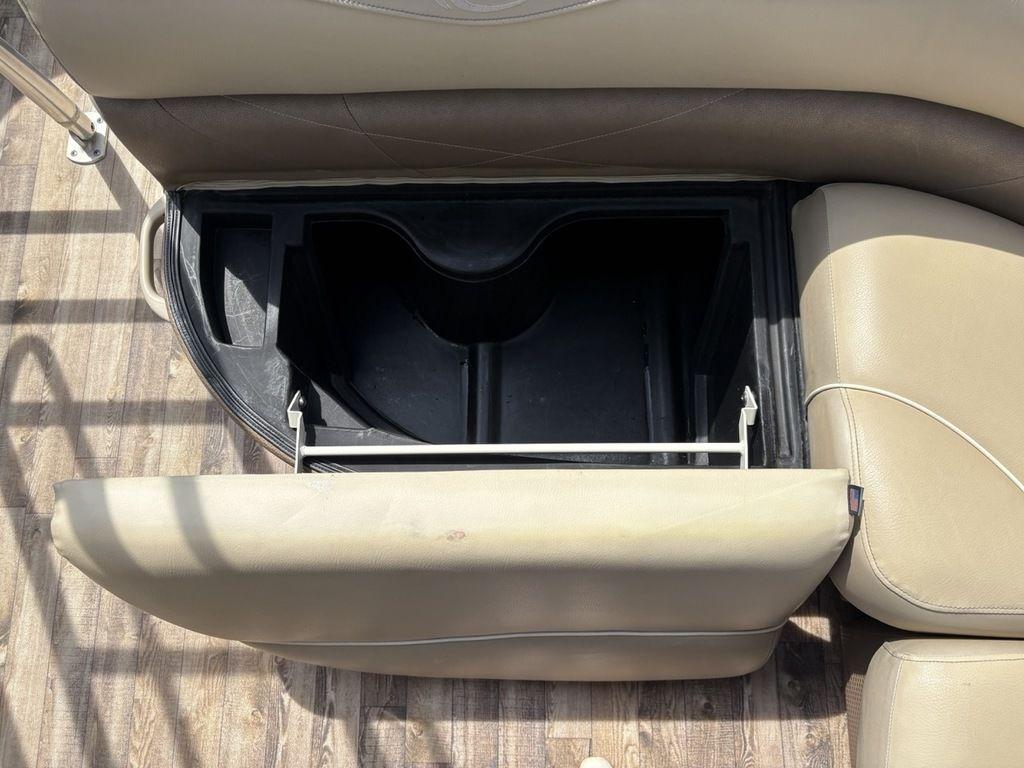 Open storage compartment in 2017 Crest Classic 250L USD CP3 boat seat.