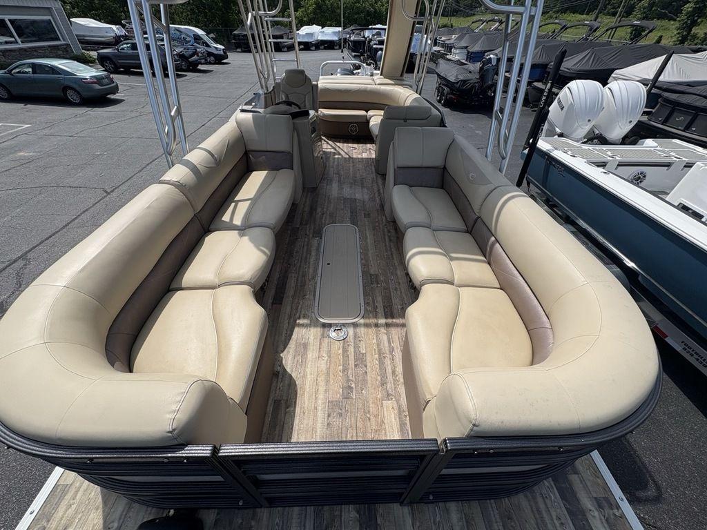 2017 Crest Classic 250L USD CP3 pontoon boat with spacious seating and wood-style flooring.