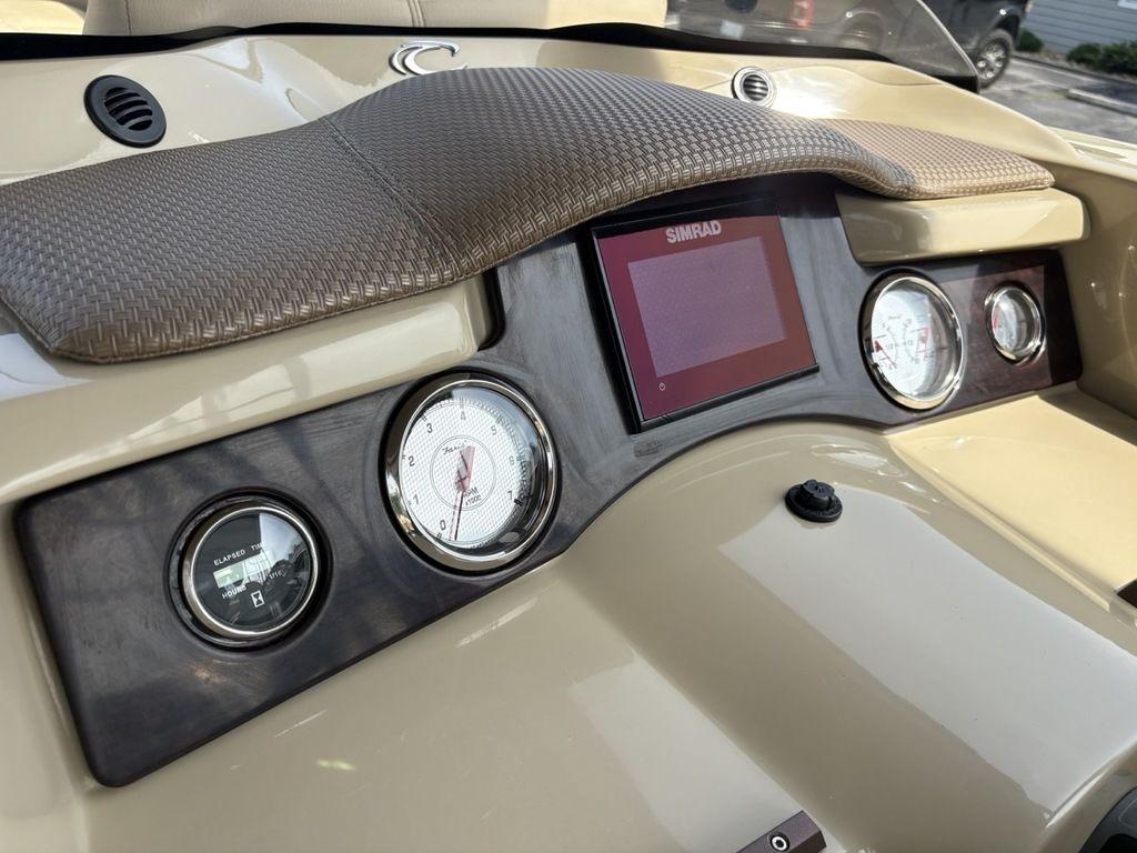 Dashboard of 2017 Crest Classic 250L USD CP3 boat with gauges and Simrad display.
